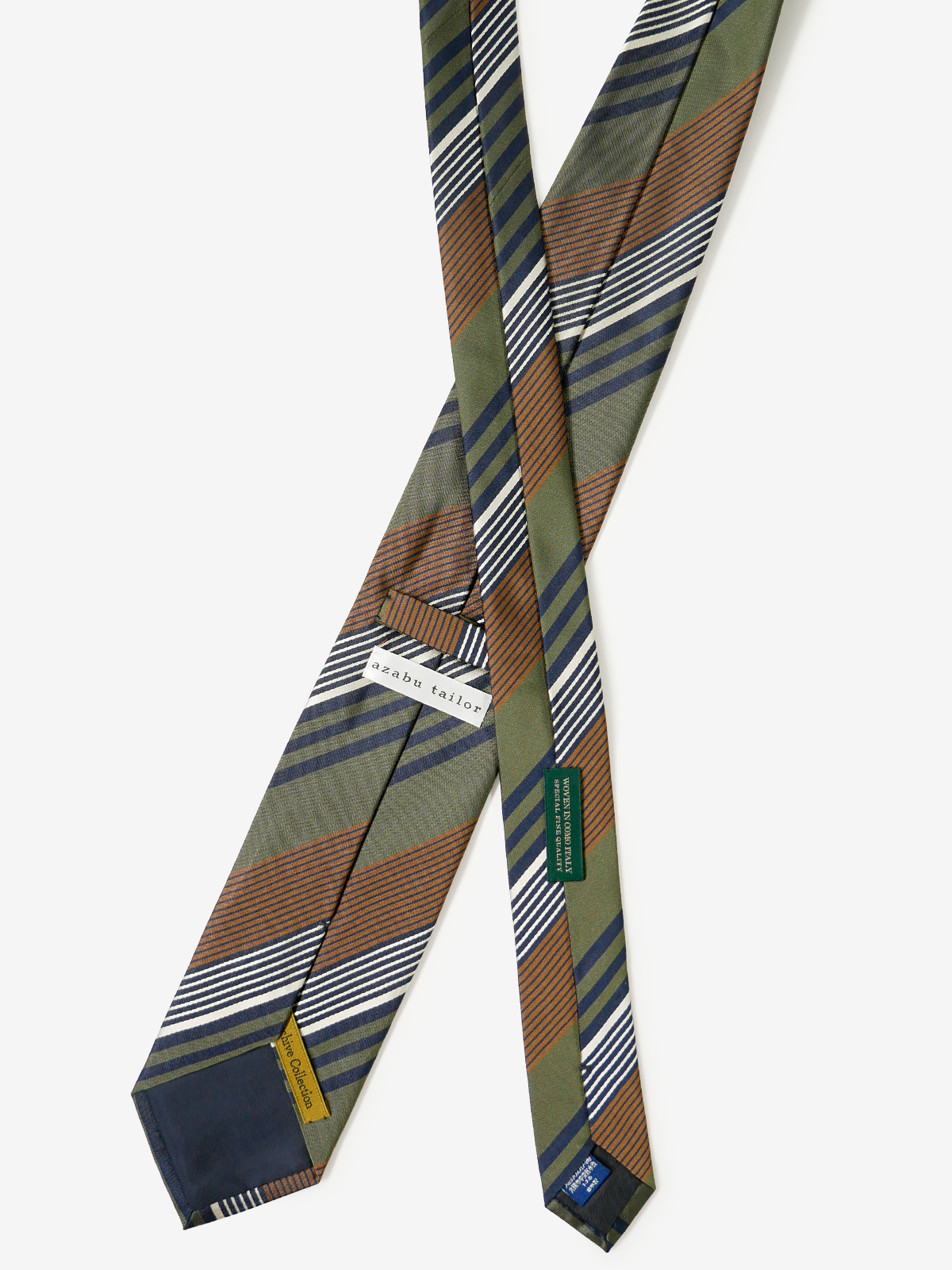 ストライプネクタイの裏側画像（麻布テーラーブランドネームタグと、イタリア製生地・日本縫製・シルク100%の製品表示）